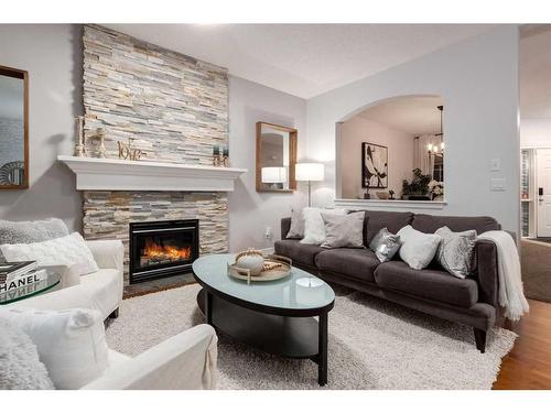 38-39 Strathlea Common Sw, Calgary, AB - Indoor Photo Showing Living Room With Fireplace