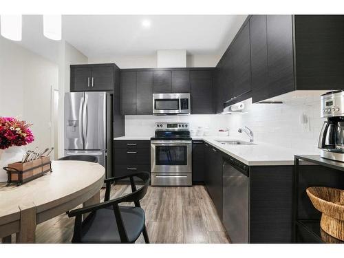 459 Canals Crossing Sw, Airdrie, AB - Indoor Photo Showing Kitchen With Stainless Steel Kitchen With Upgraded Kitchen