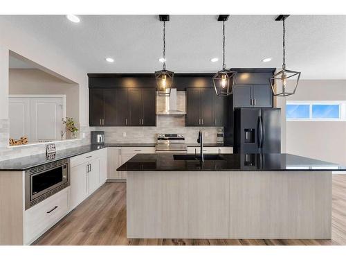 26 Cobbleridge Place Sw, Airdrie, AB - Indoor Photo Showing Kitchen With Upgraded Kitchen