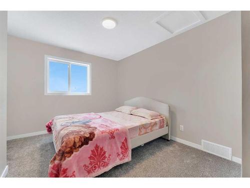 26 Cobbleridge Place Sw, Airdrie, AB - Indoor Photo Showing Bedroom