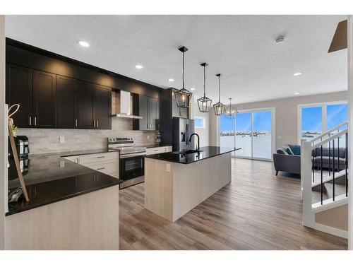 26 Cobbleridge Place Sw, Airdrie, AB - Indoor Photo Showing Kitchen With Upgraded Kitchen