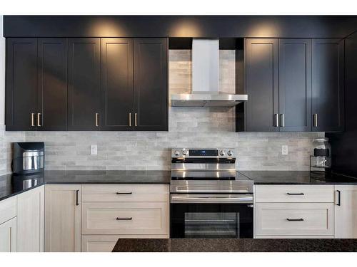 26 Cobbleridge Place Sw, Airdrie, AB - Indoor Photo Showing Kitchen With Upgraded Kitchen