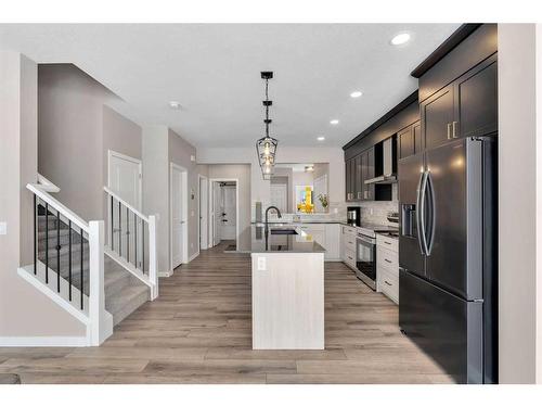 26 Cobbleridge Place Sw, Airdrie, AB - Indoor Photo Showing Kitchen With Upgraded Kitchen