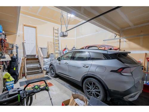 9 Silverado Saddle Heights Sw, Calgary, AB - Indoor Photo Showing Garage