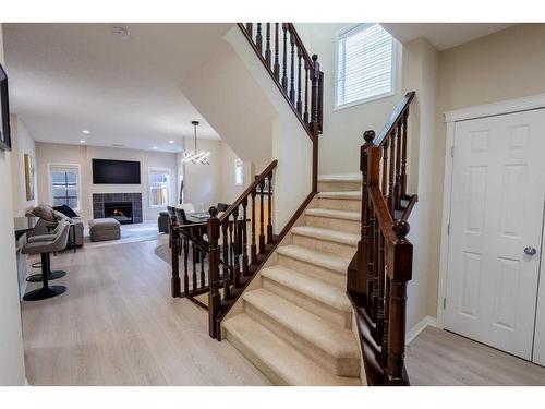 9 Silverado Saddle Heights Sw, Calgary, AB - Indoor Photo Showing Other Room With Fireplace