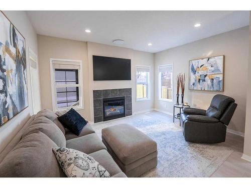 9 Silverado Saddle Heights Sw, Calgary, AB - Indoor Photo Showing Living Room With Fireplace