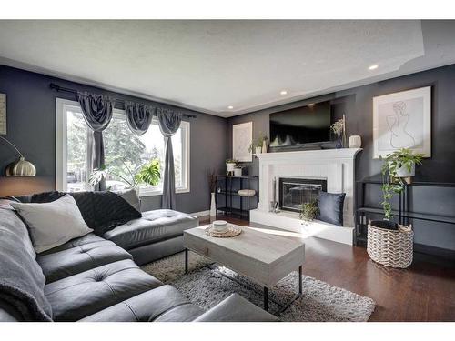 9616 Alcott Road Se, Calgary, AB - Indoor Photo Showing Living Room With Fireplace