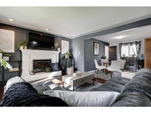 9616 Alcott Road Se, Calgary, AB - Indoor Photo Showing Living Room With Fireplace