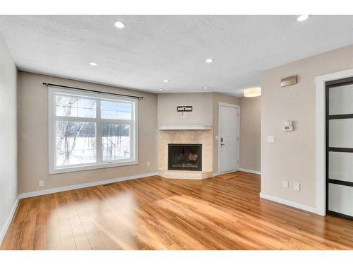 1801B 41 Street Nw, Calgary, AB - Indoor Photo Showing Living Room With Fireplace