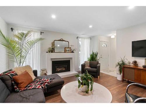 432 Lynnover Way Se, Calgary, AB - Indoor Photo Showing Living Room With Fireplace