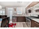 202-515 Redstone Walk Ne, Calgary, AB  - Indoor Photo Showing Kitchen With Stainless Steel Kitchen With Double Sink 