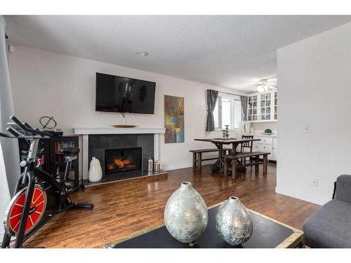 10-1739 24A Street Sw, Calgary, AB - Indoor Photo Showing Living Room With Fireplace