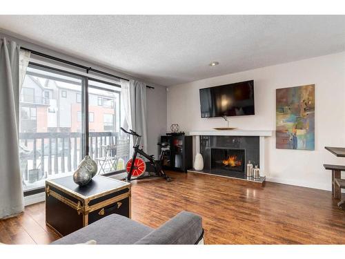 10-1739 24A Street Sw, Calgary, AB - Indoor Photo Showing Living Room With Fireplace