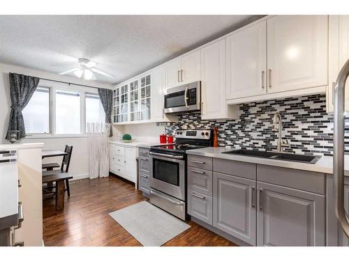 10-1739 24A Street Sw, Calgary, AB - Indoor Photo Showing Kitchen With Stainless Steel Kitchen With Double Sink With Upgraded Kitchen