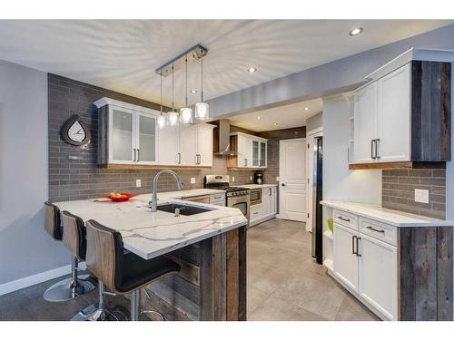 225 Cougar Ridge Drive Sw, Calgary, AB - Indoor Photo Showing Kitchen With Double Sink