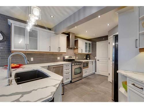 225 Cougar Ridge Drive Sw, Calgary, AB - Indoor Photo Showing Kitchen With Double Sink With Upgraded Kitchen