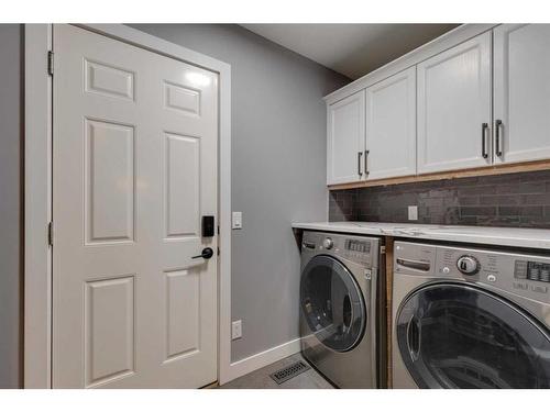 225 Cougar Ridge Drive Sw, Calgary, AB - Indoor Photo Showing Laundry Room