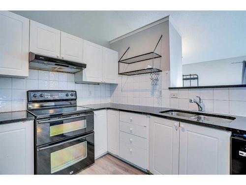 71 Mt Aberdeen Link Se, Calgary, AB - Indoor Photo Showing Kitchen With Double Sink