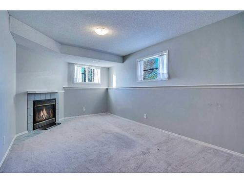 71 Mt Aberdeen Link Se, Calgary, AB - Indoor With Fireplace