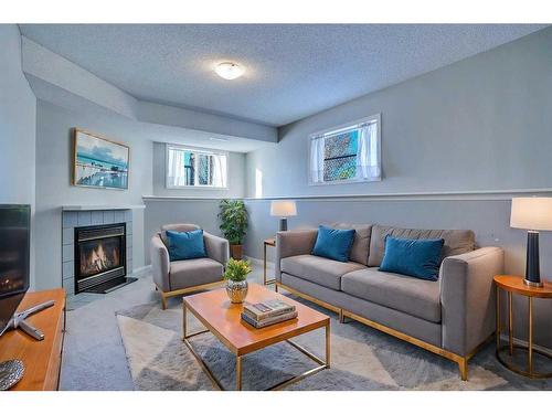 71 Mt Aberdeen Link Se, Calgary, AB - Indoor Photo Showing Living Room With Fireplace