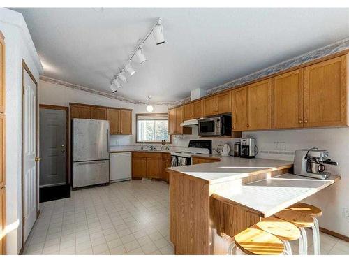 33567 Highway 584, Rural Mountain View County, AB - Indoor Photo Showing Kitchen With Double Sink