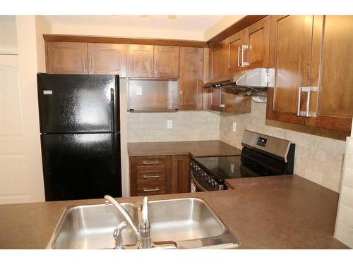 1117-130 Panatella Street Nw, Calgary, AB - Indoor Photo Showing Kitchen With Double Sink