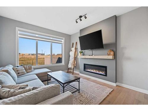 42 Waterford Road, Chestermere, AB - Indoor Photo Showing Living Room With Fireplace