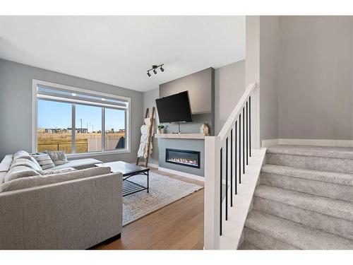 42 Waterford Road, Chestermere, AB - Indoor Photo Showing Living Room With Fireplace