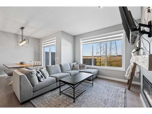 42 Waterford Road, Chestermere, AB - Indoor Photo Showing Living Room With Fireplace