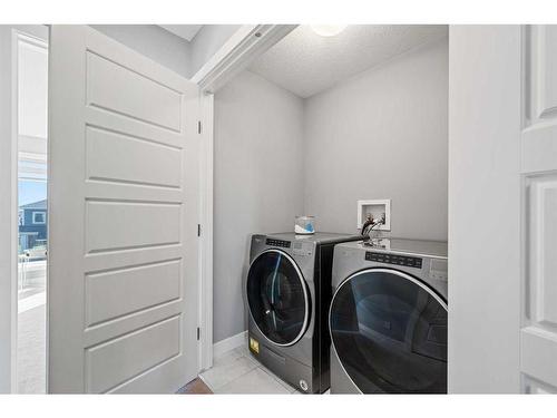 42 Waterford Road, Chestermere, AB - Indoor Photo Showing Laundry Room