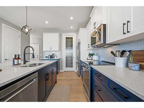 42 Waterford Road, Chestermere, AB - Indoor Photo Showing Kitchen With Double Sink With Upgraded Kitchen