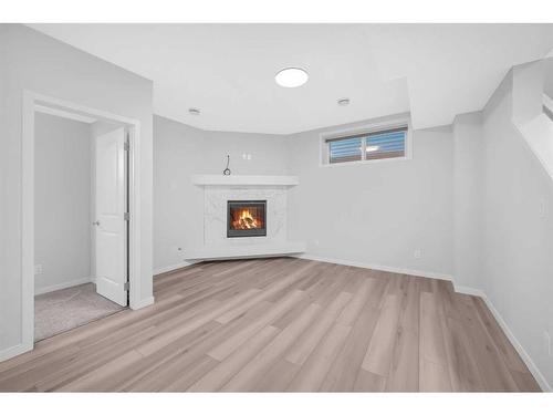 94 Belmont Crescent Sw, Calgary, AB - Indoor With Fireplace