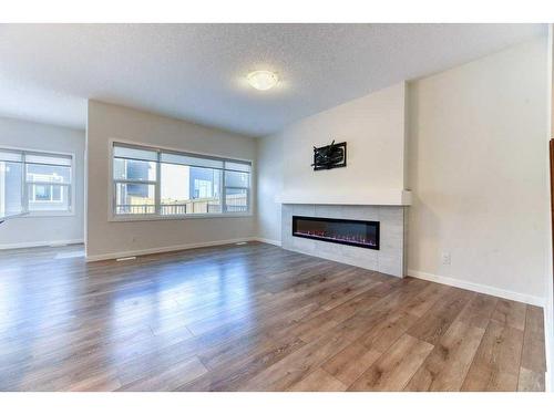 81 Legacy Reach Crescent Se, Calgary, AB - Indoor Photo Showing Living Room With Fireplace