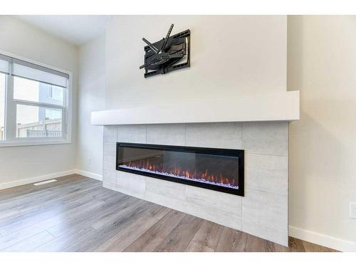 81 Legacy Reach Crescent Se, Calgary, AB - Indoor Photo Showing Living Room With Fireplace