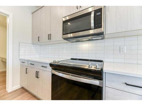 81 Legacy Reach Crescent Se, Calgary, AB - Indoor Photo Showing Kitchen With Upgraded Kitchen