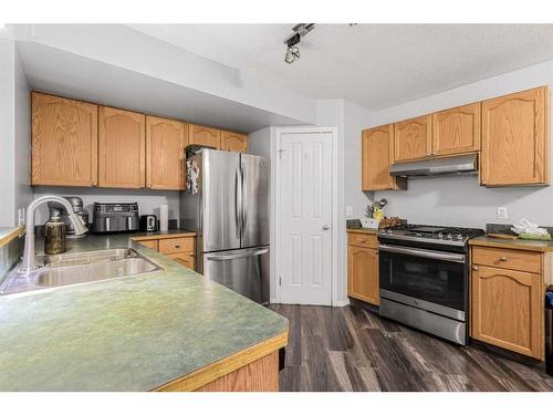 187 Panamount Heights Nw, Calgary, AB - Indoor Photo Showing Kitchen With Double Sink