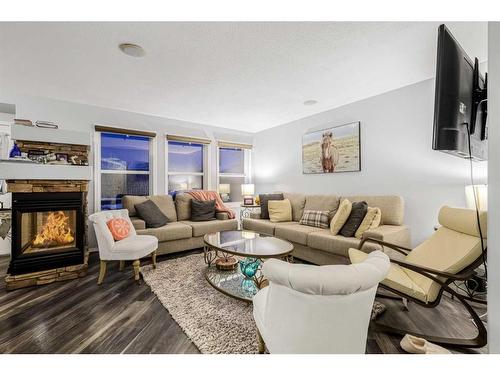 187 Panamount Heights Nw, Calgary, AB - Indoor Photo Showing Living Room With Fireplace