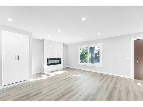 3239 Dovercliffe Road Se, Calgary, AB - Indoor Photo Showing Living Room With Fireplace