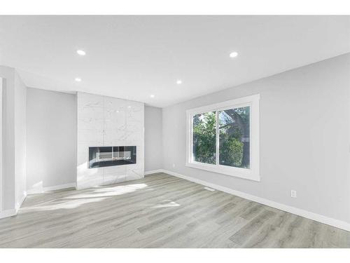 3239 Dovercliffe Road Se, Calgary, AB - Indoor Photo Showing Living Room With Fireplace