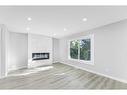 3239 Dovercliffe Road Se, Calgary, AB  - Indoor Photo Showing Living Room With Fireplace 