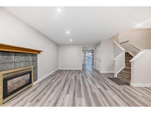 68 Martinbrook Link Ne, Calgary, AB - Indoor With Fireplace