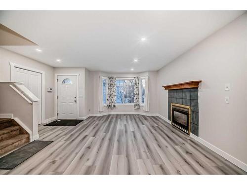 68 Martinbrook Link Ne, Calgary, AB - Indoor With Fireplace