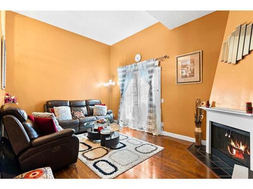 802-919 38 Street Ne, Calgary, AB - Indoor Photo Showing Living Room With Fireplace