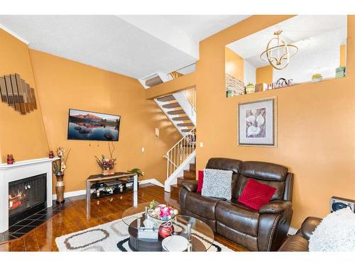 802-919 38 Street Ne, Calgary, AB - Indoor Photo Showing Living Room With Fireplace