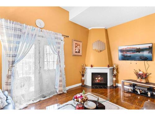 802-919 38 Street Ne, Calgary, AB - Indoor Photo Showing Living Room With Fireplace