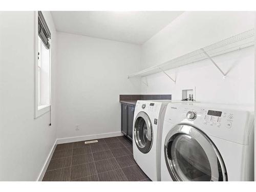 134 Rainbow Falls Blvd, Chestermere, AB - Indoor Photo Showing Laundry Room