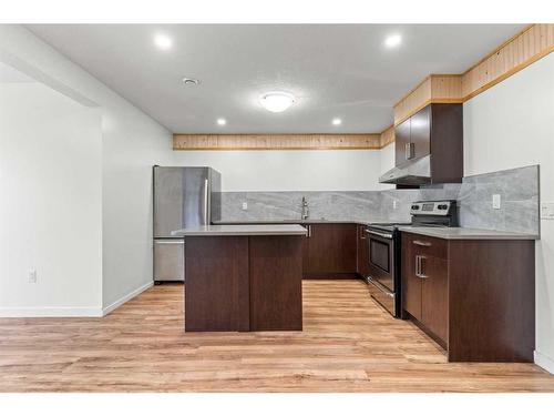 134 Rainbow Falls Blvd, Chestermere, AB - Indoor Photo Showing Kitchen