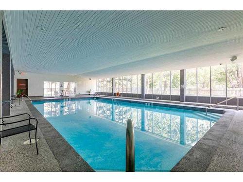 1510-4944 Dalton Drive Nw, Calgary, AB - Indoor Photo Showing Other Room With In Ground Pool