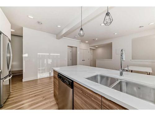 248 Seton Passage Se, Calgary, AB - Indoor Photo Showing Kitchen With Double Sink