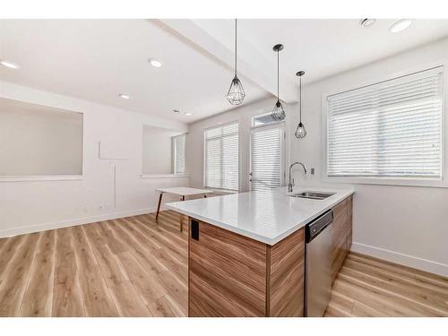 248 Seton Passage Se, Calgary, AB - Indoor Photo Showing Kitchen With Double Sink